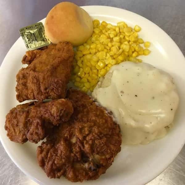 fried chicken with mashed potatoes, corn, and a biscuit