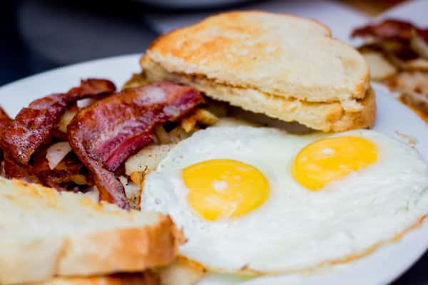 Two eggs with your choice of either ham steak, pork banger, bacon, link or patty sausage, hashbrowns and toast