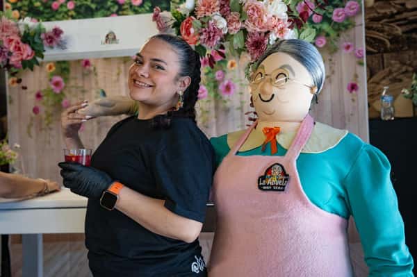 staff member next to Abuela figure