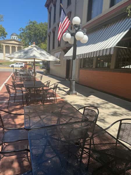 Outdoor patio seating at Serafini Italian fusion restaurant in historic downtown Frankfort, Kentucky, perfect for spring and summer dining.