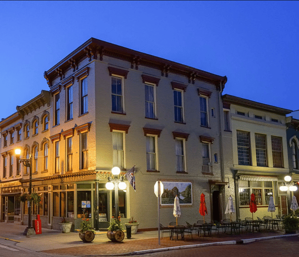 Exterior view of Serafini Italian fusion restaurant with outdoor patio seating in historic downtown Frankfort, Kentucky, across from the Old State Capitol.