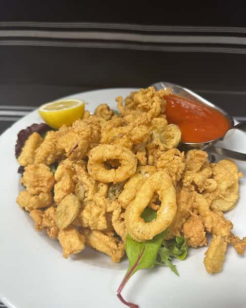 Crispy fried calamari with lemon and marinara sauce at Positano Ristorante Italiano in Palm Harbor