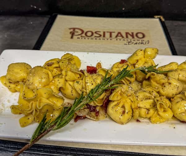 Cheese tortellini pasta with grilled asparagus and crispy pancetta at Positano Ristorante Italiano in Palm Harbor