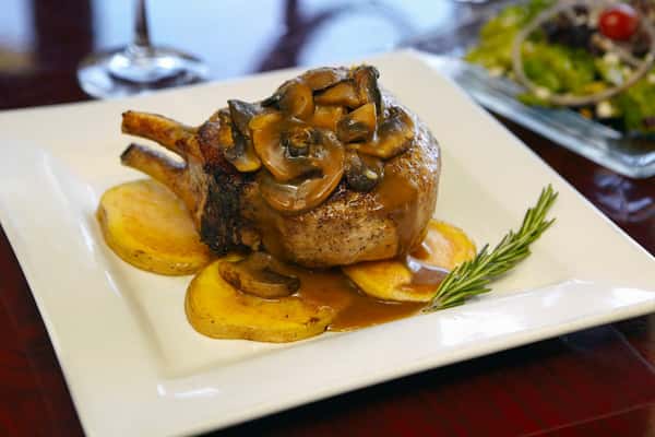 Filet mignon topped with mushroom sauce served with roasted potatoes at Positano Ristorante Italiano