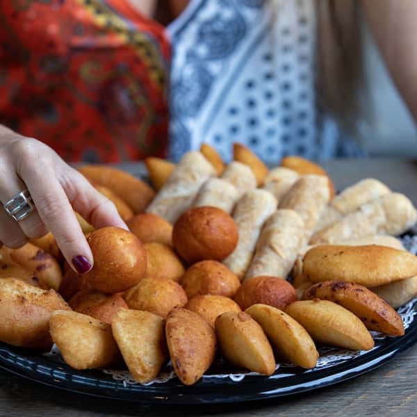 Catering - 50 People: Includes a 1/2 Sheet Cake | 50 Mini Ham Croquettes | 50 Mini Tequenos | 50 Mini Ham or Ham and Cheese Cachitos.