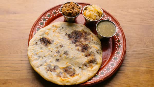 Carnita Pupusa with Green Salsa and Curtido