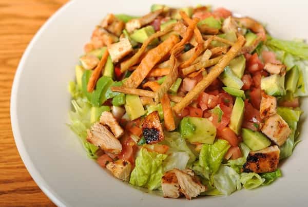 Salad with grilled chicken and crispy tortilla strips