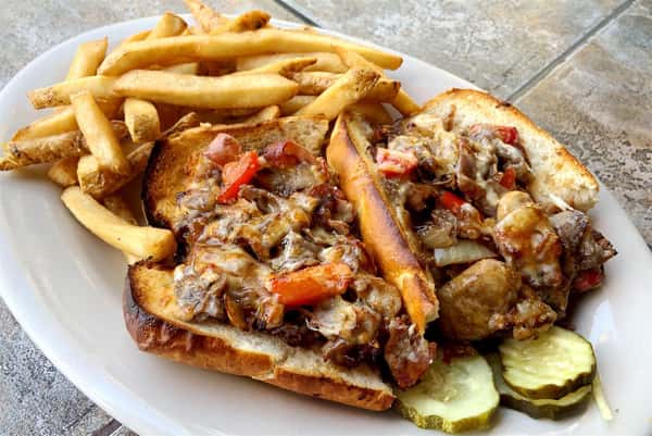 Steak & cheese sandwich with french fries