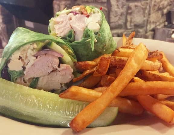 Chicken spinach wrap with french fries and pickle