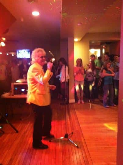 Sir Rod performing at Casey's with people watching in the background