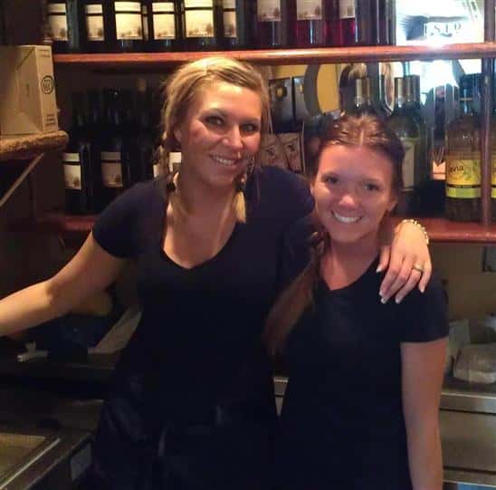 Two employees posing for the camera