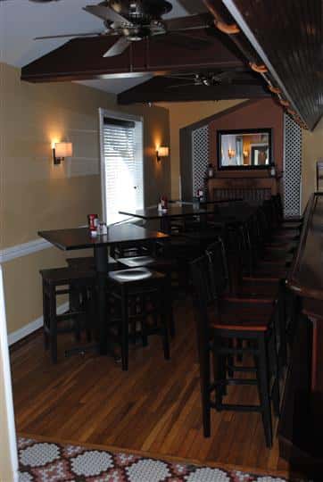 high top tables and chairs with ketchup, salt, and pepper
