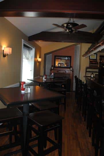 high top tables and chairs with ketchup, salt, and pepper