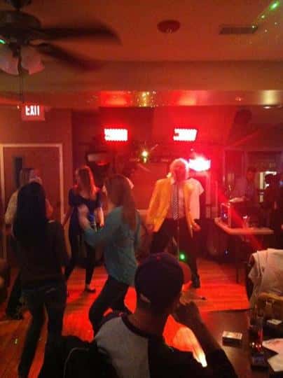 Sir Rod performing at Casey's with people dancing on the dance floor
