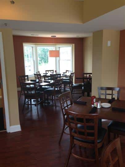 round tables and chairs in the dining room