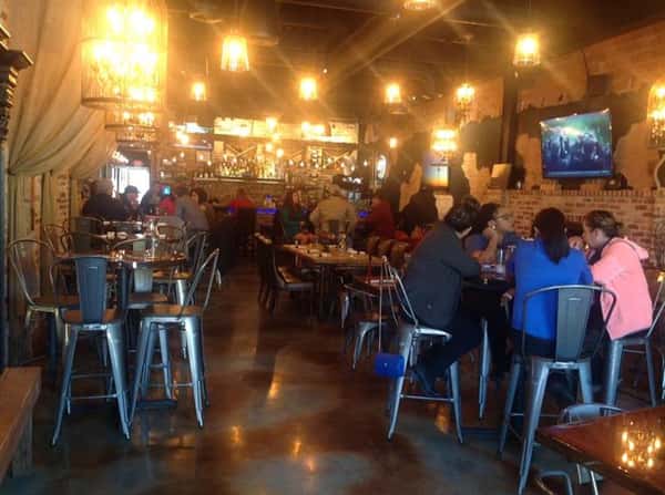 customers sitting at tables inside restaurant
