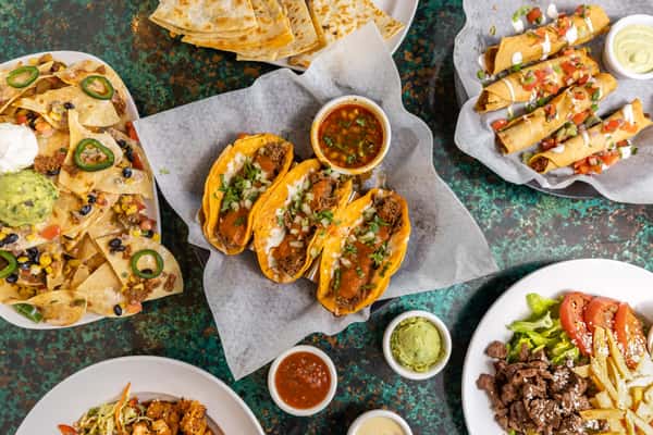 Various Mexican dishes on a table