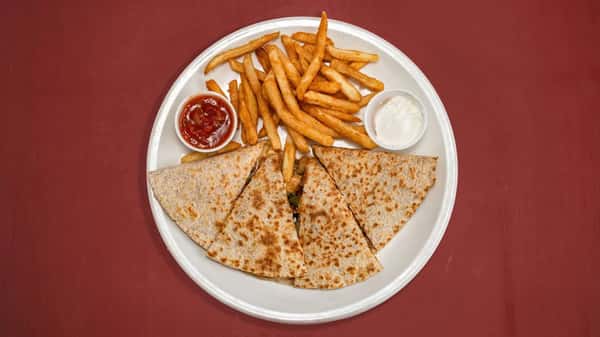Grilled quesadilla slices served with golden fries, salsa, and sour cream on a white plate over a red tabletop.