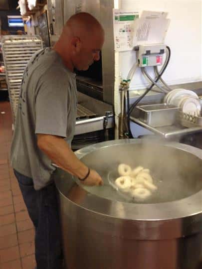 Chef frying bagels
