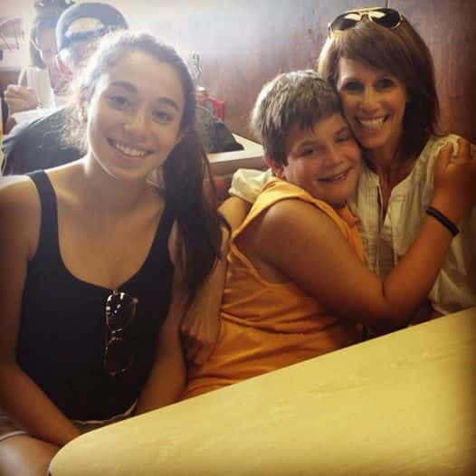 family smiling for a picture together