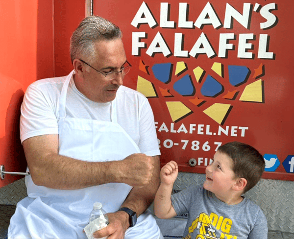 Allan and customer fist bumping