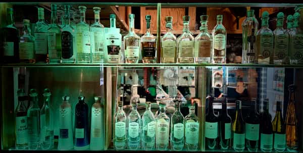 A curated selection of additive-free tequila and mezcal behind the bar at Joselito's Private Party Room in Tujunga, Los Angeles.