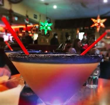 Award winning margarita with a black salt rim at Joselito's Los Angeles, enjoyed in a warm and festive dining room atmosphere.