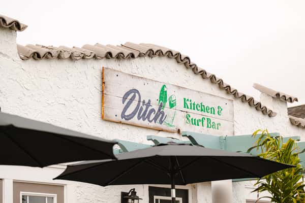 Exterior sign of Ditch Kitchen and Surf bar