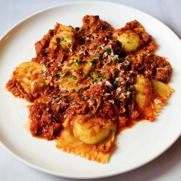 Ragù alla Bolognese with fresh spinach ricotta ravioli