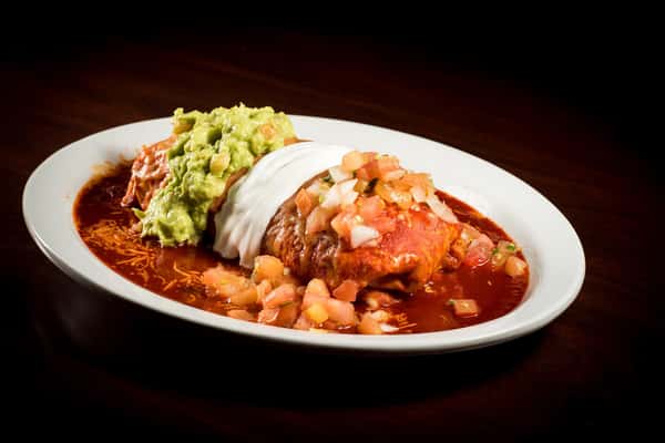 Wet Burrito: meat, whole beans and rice. Topped with our homemade enchilada sauce, cheese, sour cream and guacamole.