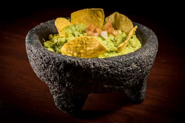 Molcajete with guacamole and chips