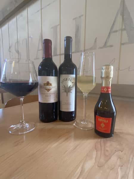 A curated selection of fine wines served at La Stalla Osteria & Bar, where each bottle promises a taste of Italy's finest for wine enthusiasts in Stoughton, MA.