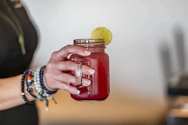 holding mason jar
