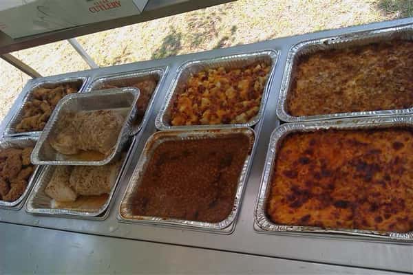Catering table with multiple food in stoves