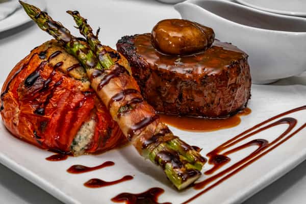 Russell's Cut 14oz Center Cut Filet, Bleu Cheese Demi Glace, Stuffed Tomato, Prosciutto Wrapped Asparagus
