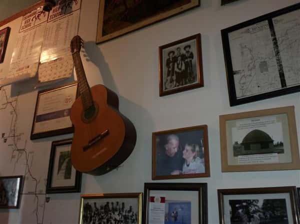 Mounted Guitar and framed photos