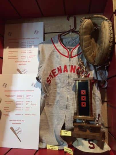 Old Jersey with sport trophy, catcher's mitt,