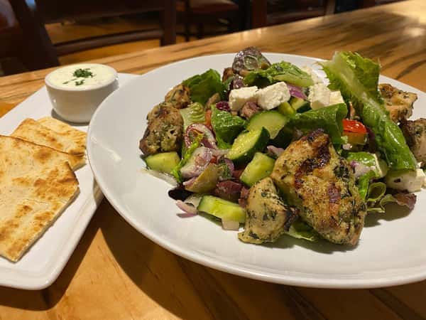 We are featuring an entree salad which is more of an entree with Chicken Souvlaki, baby red and green romaine, marinated Greek olives, tomatoes and red onion, with gorgeous aged feta and a classic Greek yogurt red wine vinaigrette with pita and tzatziki.