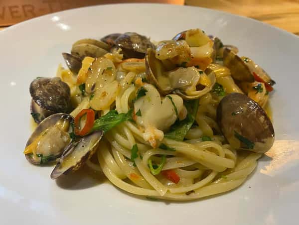 Linguine with baby clams, smoked shrimp, Calabrian chili, babay arugula, light lemon butter sauce