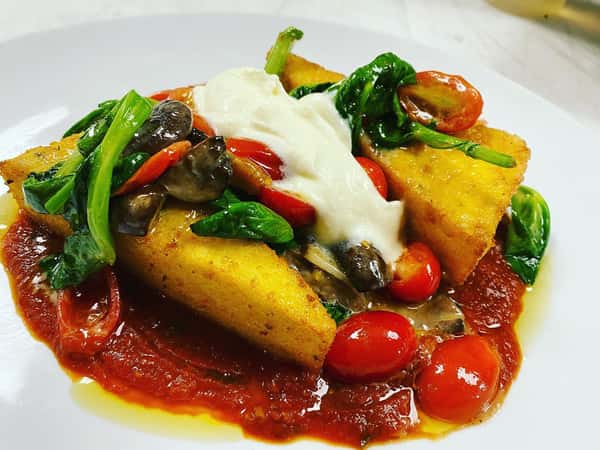 Herbed polenta, pea leaves,
Mushrooms and grape tomato with house whipped ricotta and San Marzano tomato sauce