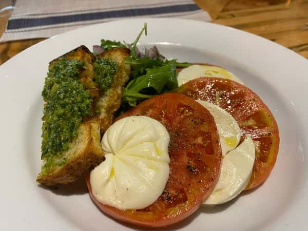 House made mozzarella with @sporthillfarm summer tomatoes, pine nut basil toasts, baby arugula