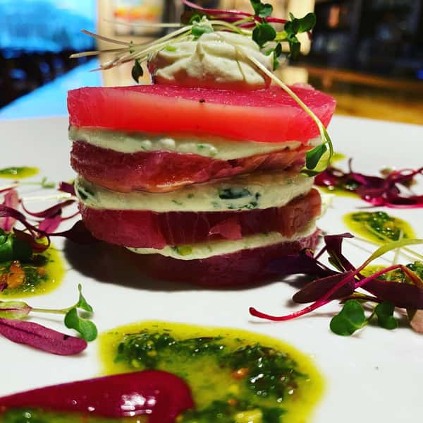 Cayuga beet and goat cheese napoleon with pistachio, basil, and beet oil