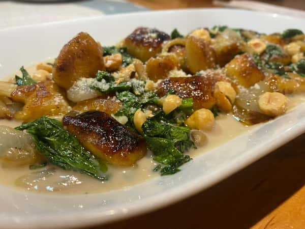 Parsnip gnocchi, toasted hazelnut, honshemeji mushroom, cipollini onion, mustard greens, chestnut cream. This dish is screaming fall.