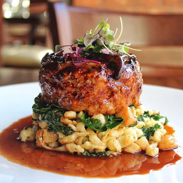 Veal Meatloaf with sautéed spaetzle, wilted kale, mushroom sauce