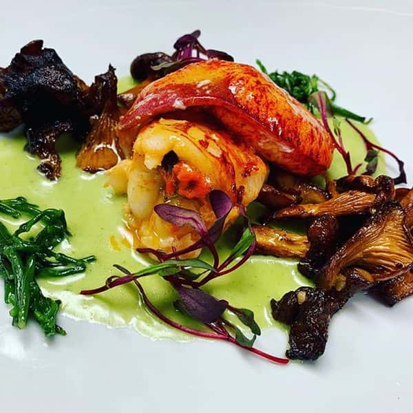 Butter poached lobster with sea beans, chanterelles, chervil lobster sauce