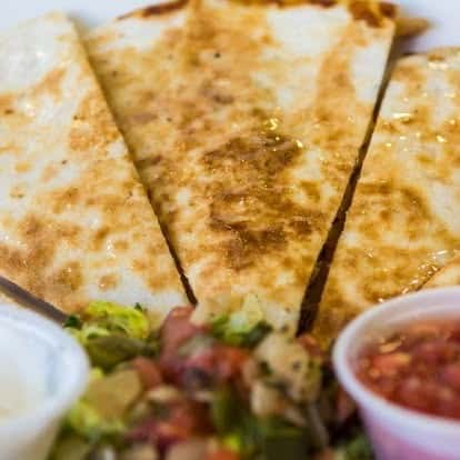 Golden grilled quesadilla wedges served with fresh pico de gallo and creamy dipping sauce.
