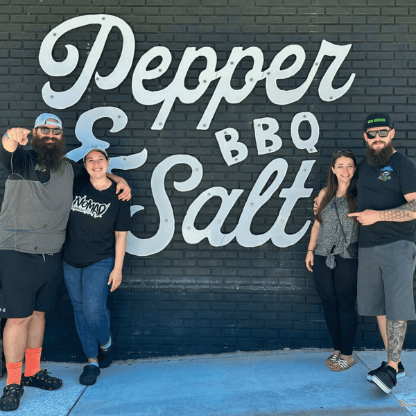 staff members in front of restaurant