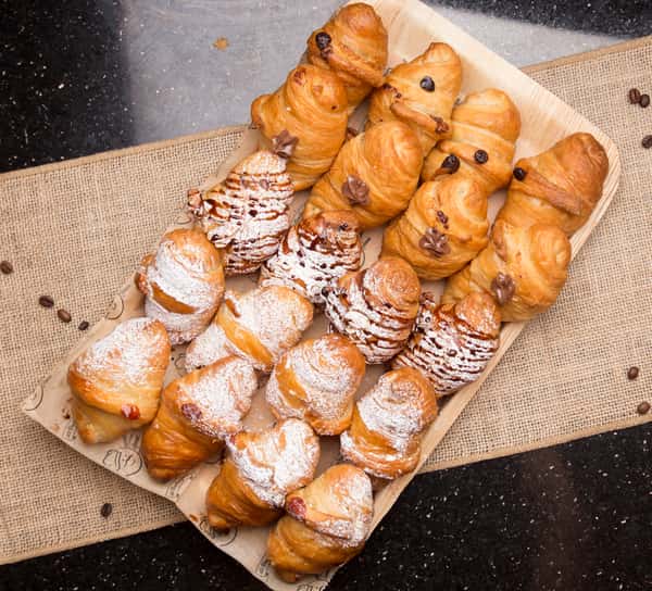 Tray of assorted fresh-baked croissants