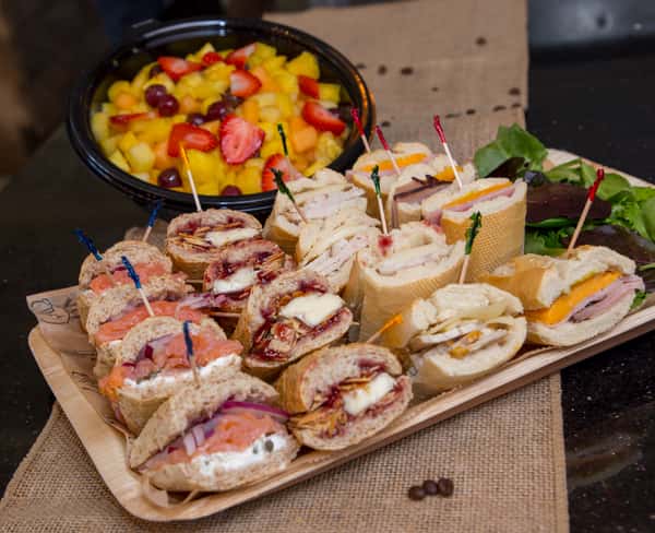 assorted sandwich platter and fruit salad