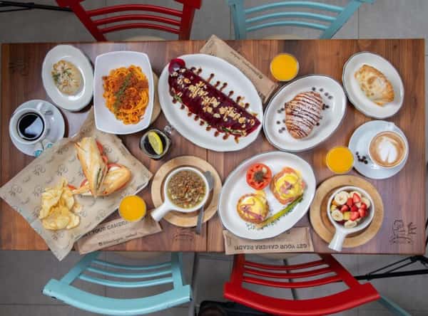 Table full of several menu dishes